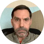 A close up image of Chris, who is a happy client after painting his home.