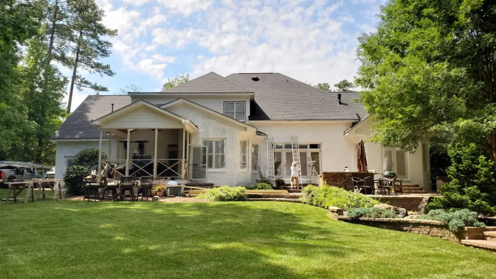 A Touch of Color Painters, painting the back of a house.