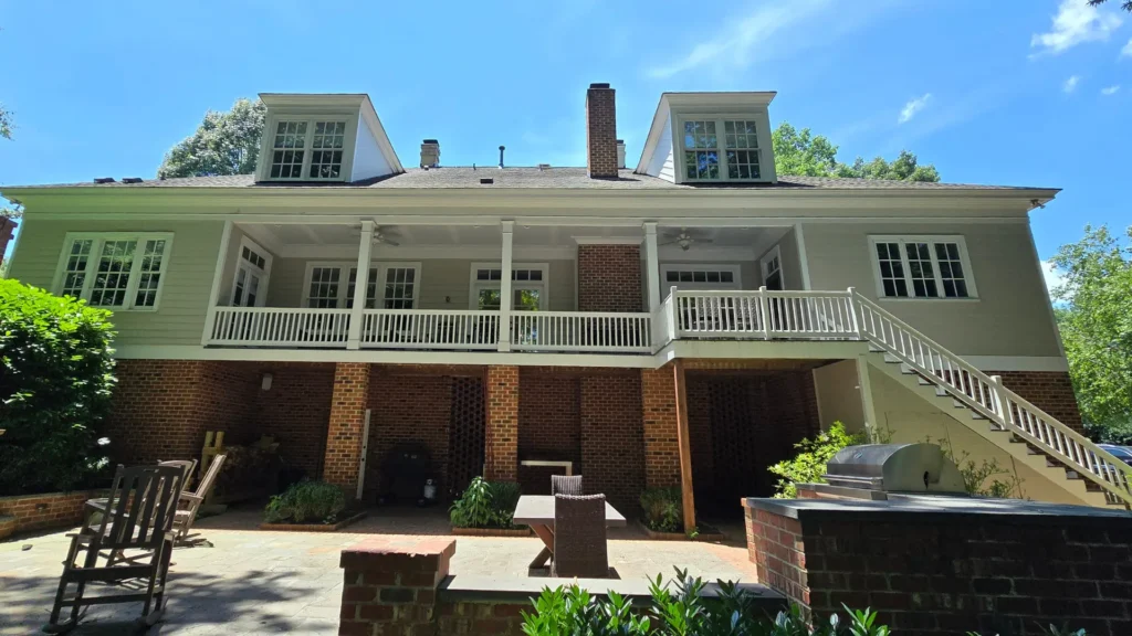 Exterior painting of a luxury residential home in the Governors Club neighborhood of Chapel Hill, NC, by A Touch of Color.
