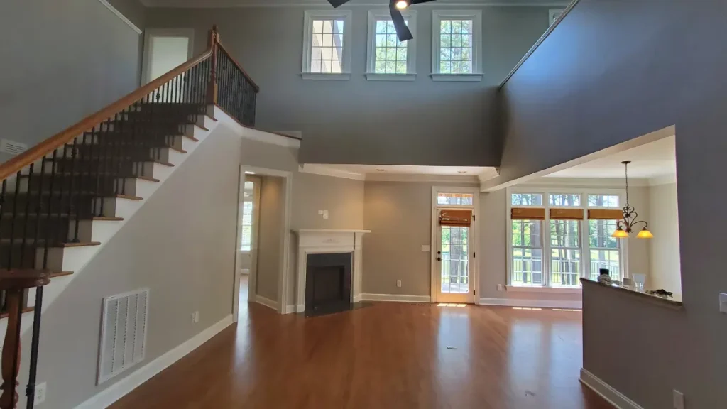 An empty home's indoor living space after painting the ceiling, walls, and trim in premium Sherwin-Williams paints.