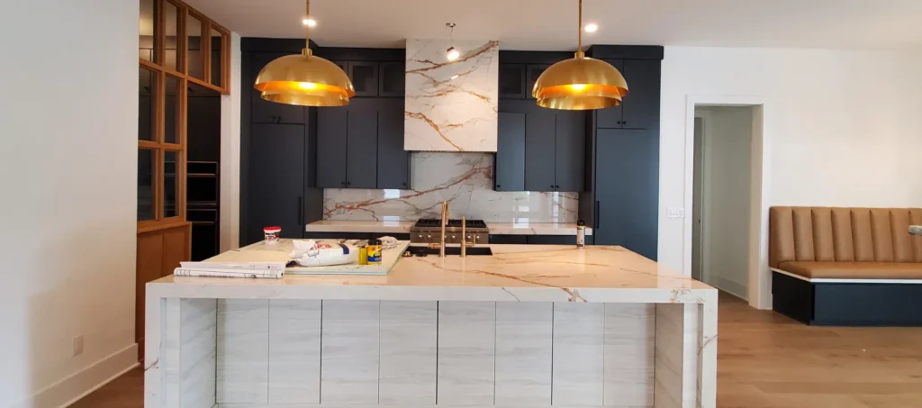 Professional kitchen cabinet refinishing in Raleigh, NC featuring a modern deep blue finish with gold hardware in a North Hills home.