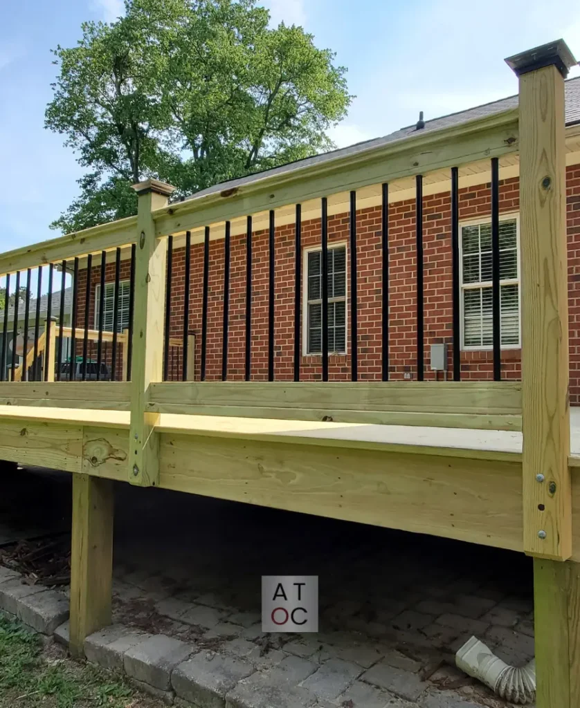 Full custom deck construction in Northeast Raleigh (27616) by a Licensed GC, featuring sleek aluminum railing systems and premium pressure-treated wood flooring.