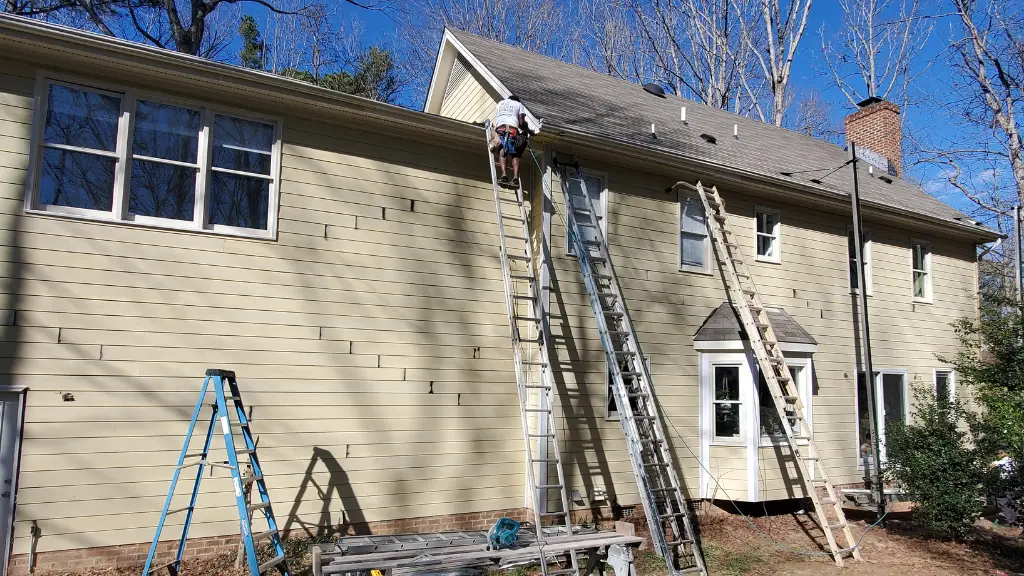 Full fiber cement siding upgrade in Raleigh, NC by A Touch of Color, featuring professionally primed edges and expansion joint flashing by a licensed contractor.