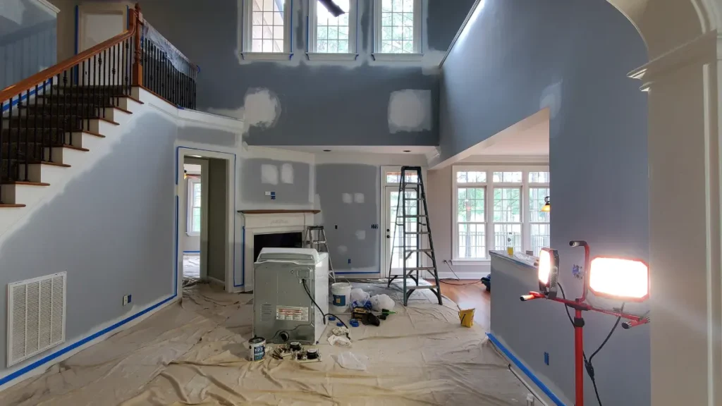 Extensive wall prep before painting the inside of a two story living room.