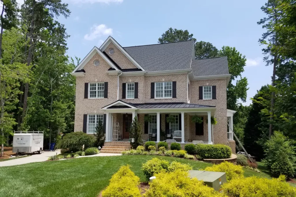Professionally hand painted trim on a home exterior by A Touch of Color Painting.