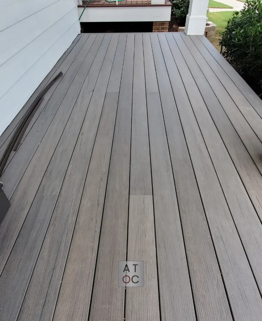 Up-close view of modern gray TimberTech composite decking, a moisture-resistant and rot-proof flooring solution preferred by top Raleigh deck contractors.
