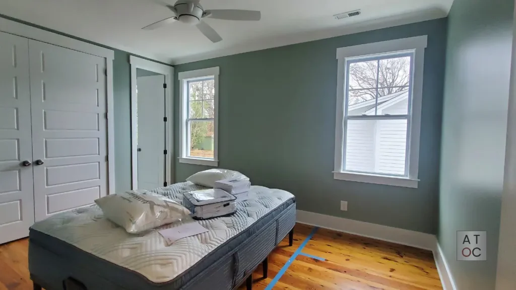 Completed bedroom painting project in Raleigh showcasing a smooth, matte finish for a calm and modern interior.