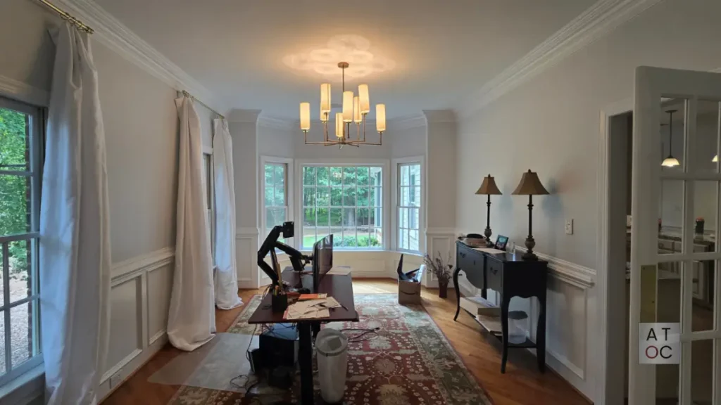 Brightly lit dining room interior painting in West Cary (27519) near Green Level Road, featuring premium satin-finish walls and crisp white trim by A Touch of Color.