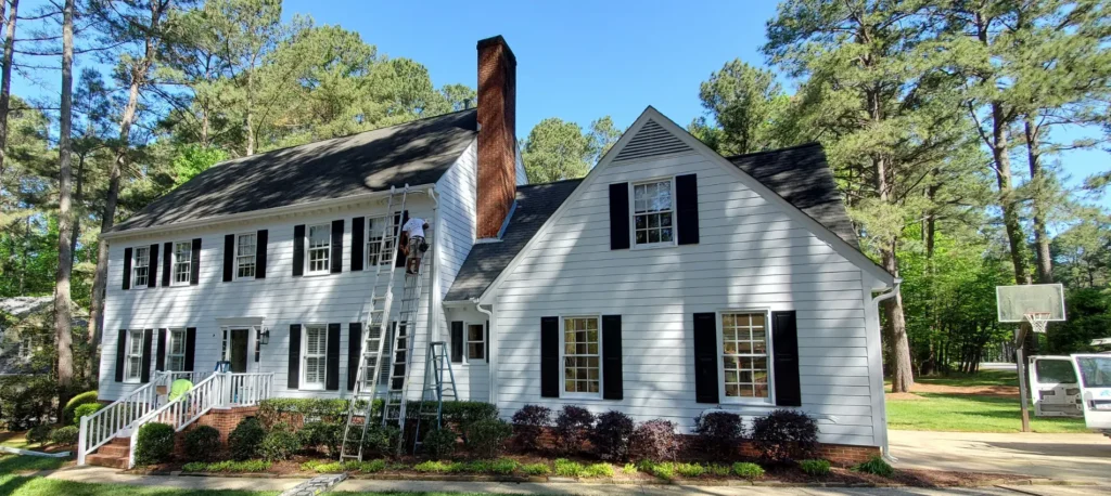 Professional white siding installation on a traditional home in the Byrum Woods neighborhood of Raleigh, NC