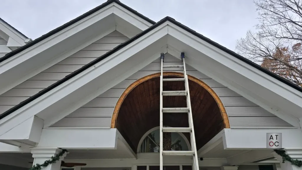 Replacing a custom piece of trim around the arch of a front porch ceiling in Cary, NC.