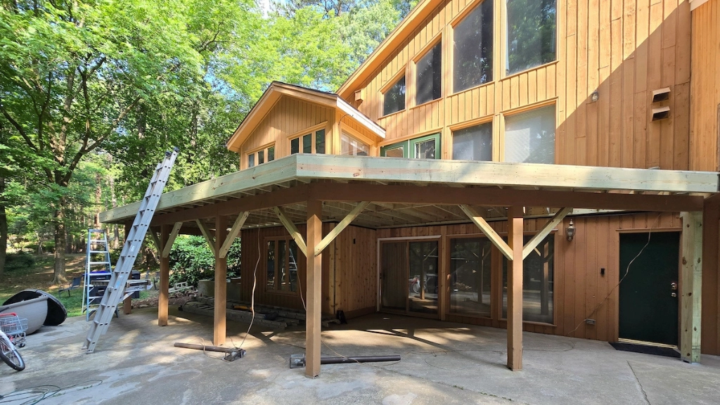 The substructure of a deck being built in stage 2 by A Touch of Color Painting & General Contracting.