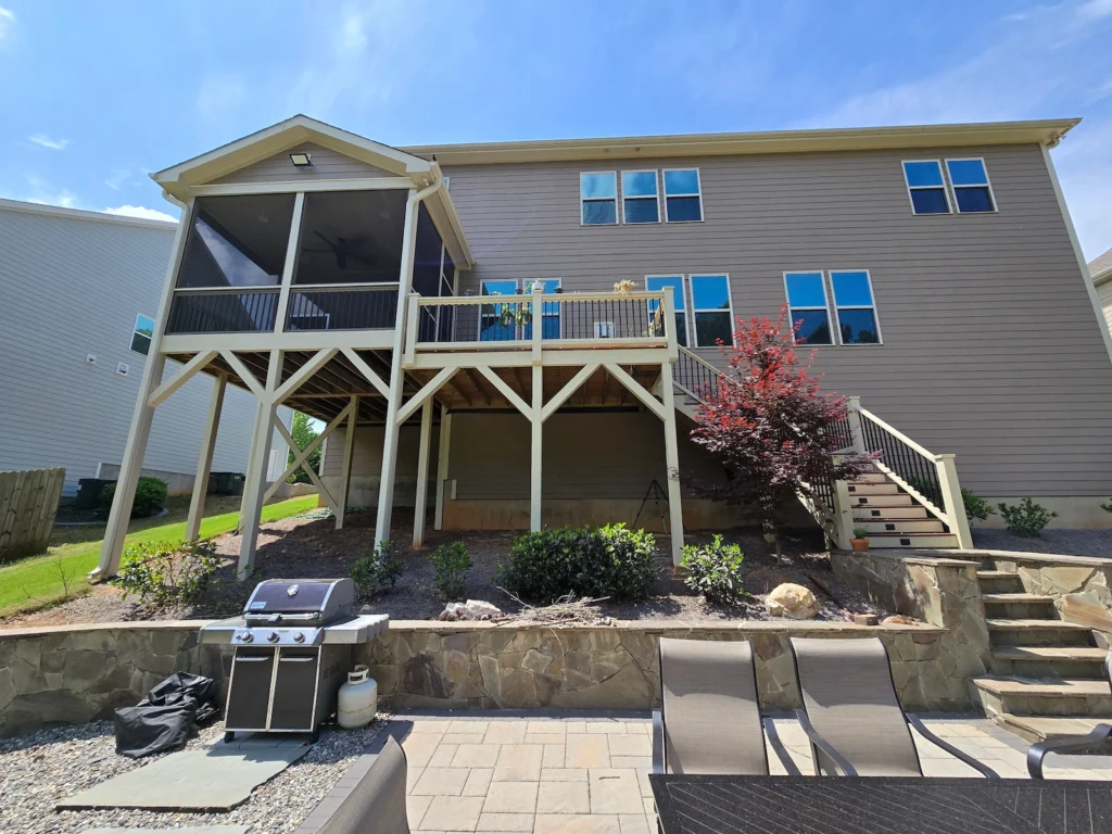 A professionally built, painted, and stained rear porch and deck in Cary, NC, showcasing high-durability wood restoration, replacement, and designed. 