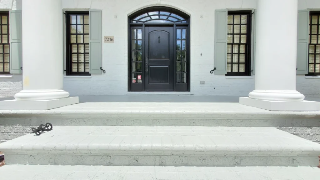 Front steps closeup on a brick house painted by A Touch of Color Painting. 