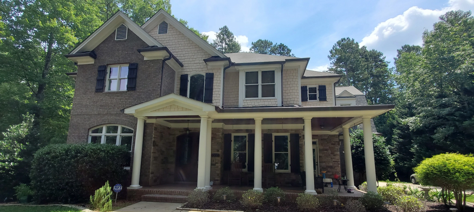 Southern home exterior porch and freshly painted trim.