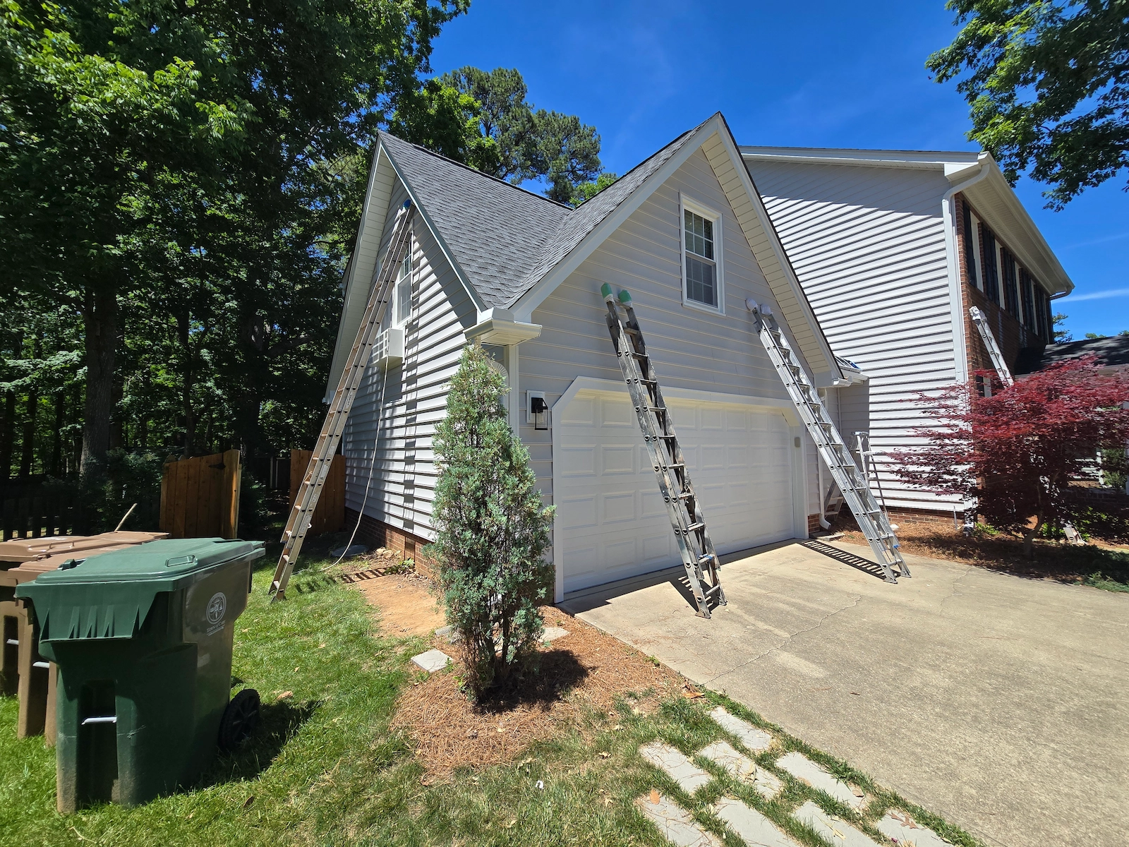 Light gray house after painting the vinyl siding. Light gray house after painting the vinyl siding.