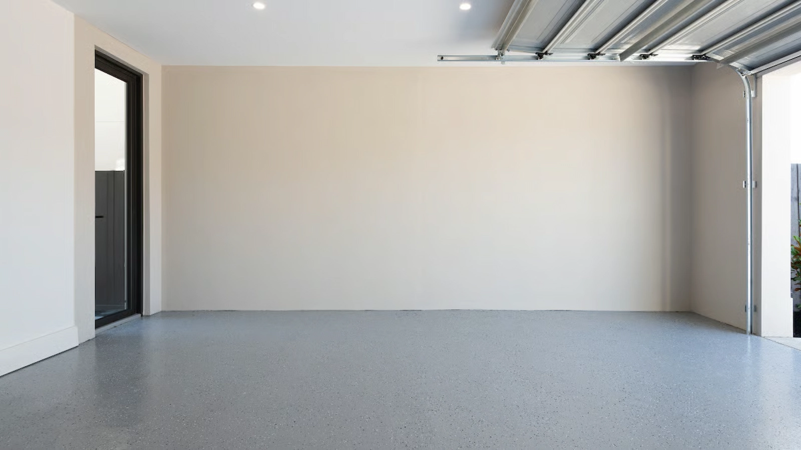 "Professional installation of a high-solids polyaspartic polyurea garage floor coating in Raleigh, NC, featuring industrial diamond grinding and a moisture vapor barrier to ensure a permanent molecular bond with the concrete substrate.