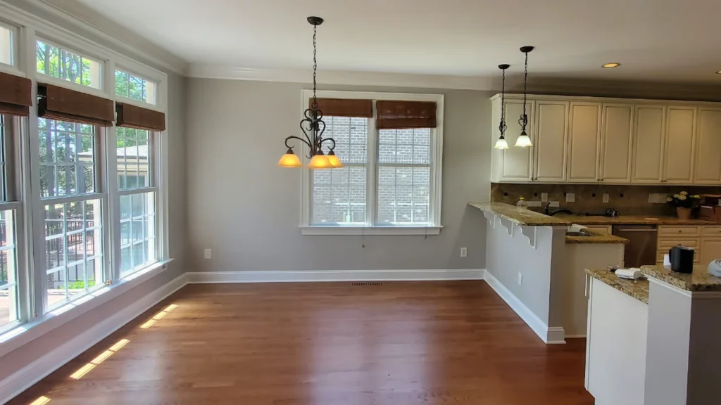 Gray interior walls, white trim and ceilings inside a kitchen in Wake Forest, painted by ATOC"s interior painters.