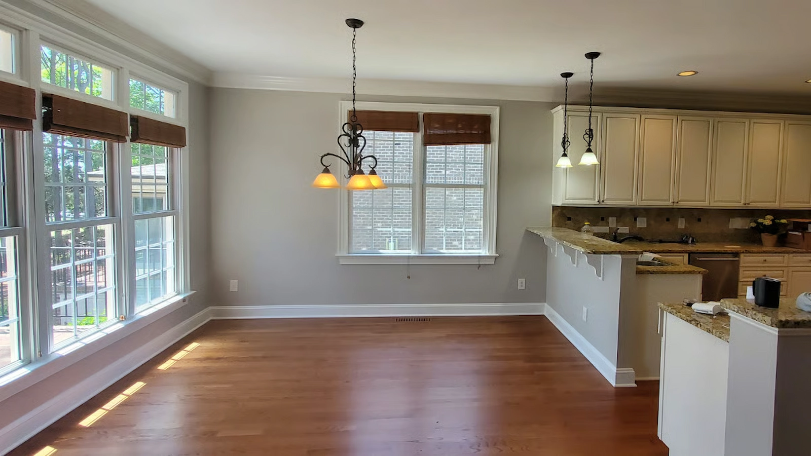 Gray interior walls, white trim and ceilings inside a kitchen in Wake Forest, painted by ATOC"s interior painters.