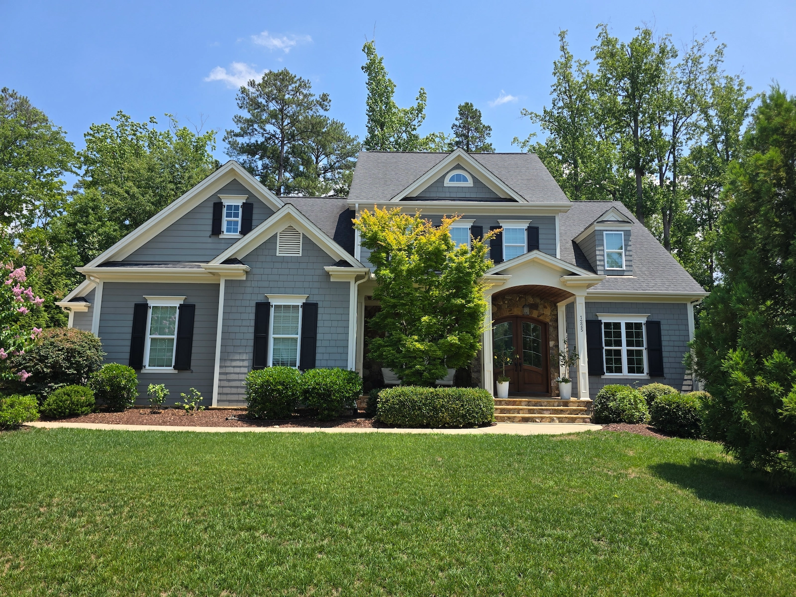 Professional residential exterior painting on Reservoir View Ln in the Traditions subdivision of Wake Forest, NC, featuring high-performance architectural coatings .