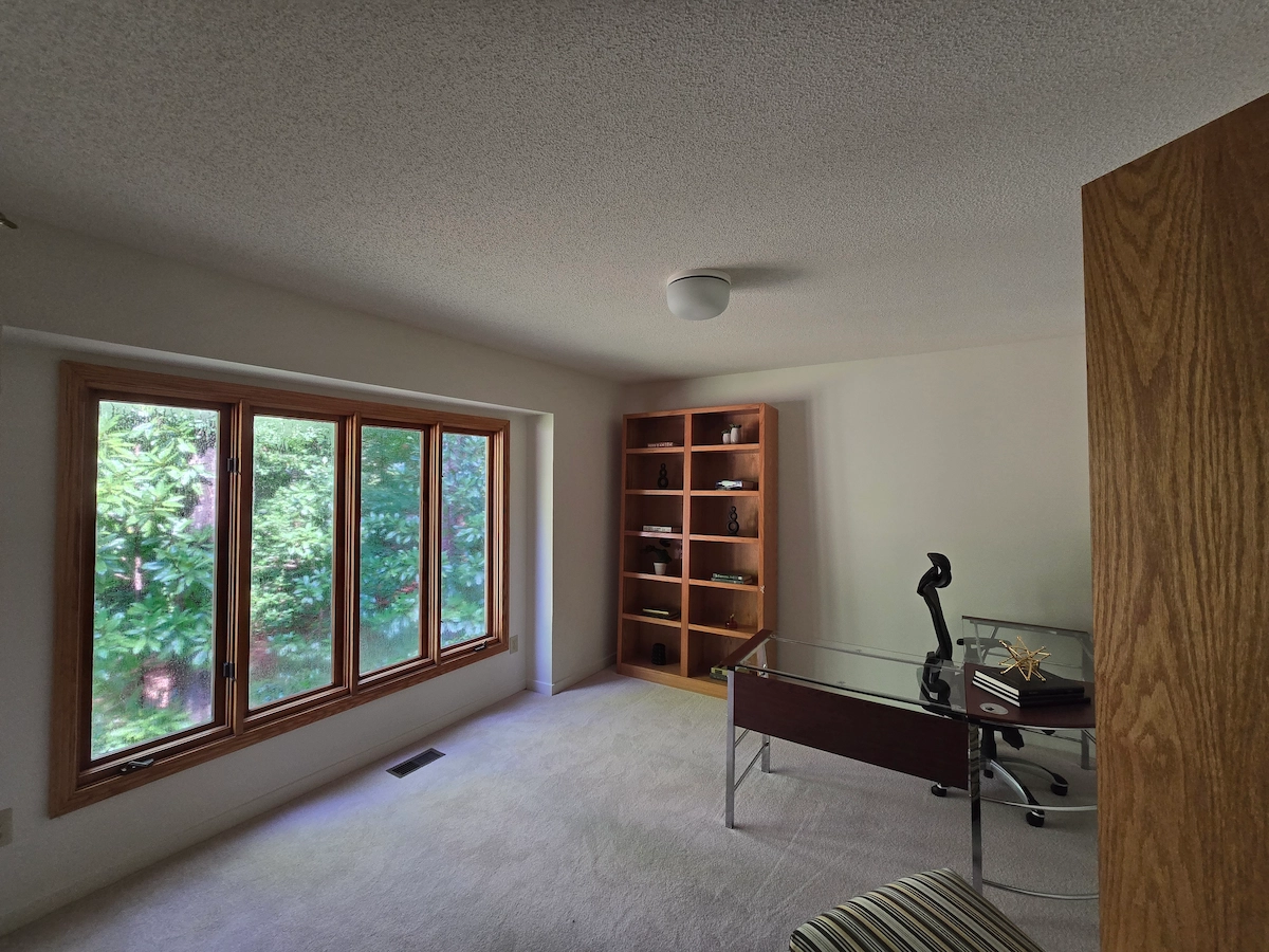 Starting the process of popcorn ceiling removal in a low height bedroom.