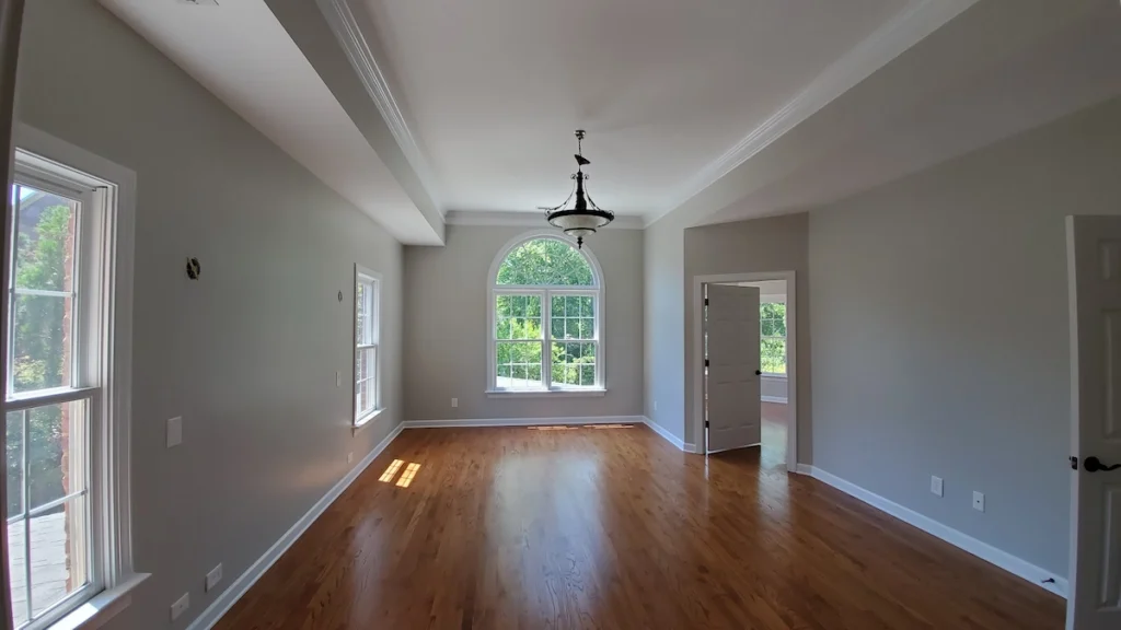 A bedroom ceiling repaired and painted to match the trim.